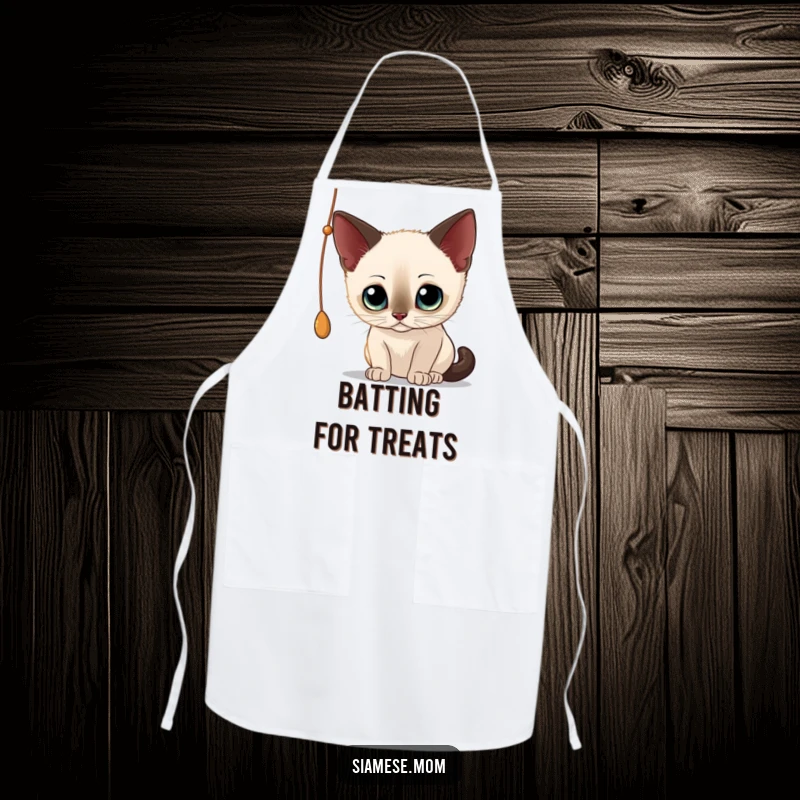 Funny Siamese Cat Apron: Whimsical design of a curious cat playing with a dangling string, ideal for kitchen fun.