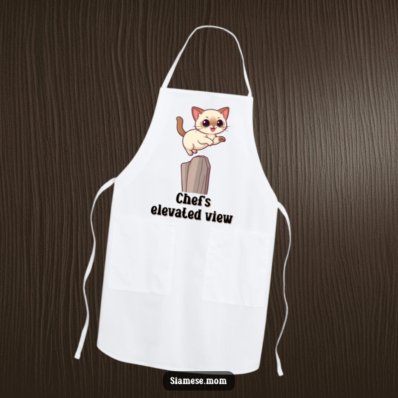 Funny Kawaii Siamese cat apron showing a cat leaping gracefully onto a high perch, ideal for a skilled cook.