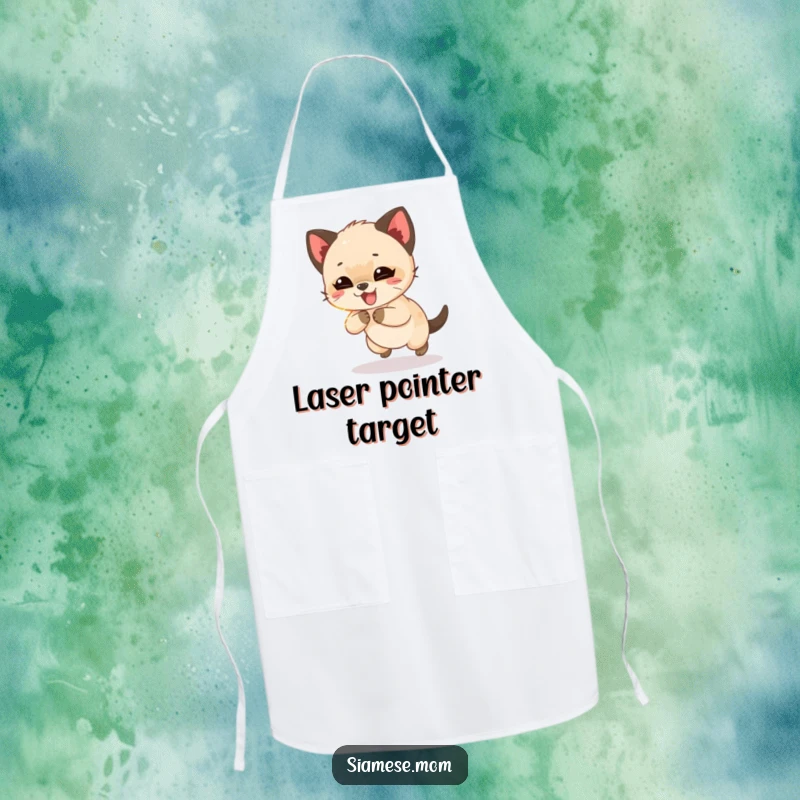 Funny Siamese cub giggling while chasing a shimmering light beam, a humorous and practical apron for kitchen shenanigans.