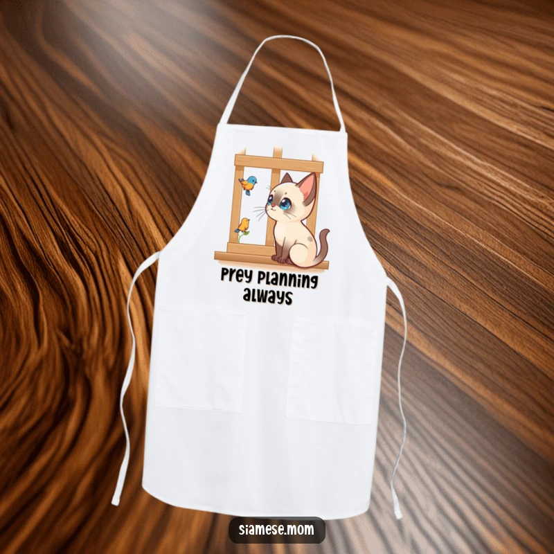 Funny Kawaii Siamese cat apron showing intense bird watching through a window, a humorous kitchen accessory for watchers.