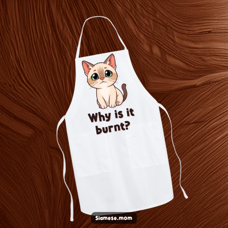 Funny apron design of a kawaii Siamese cat with a questioning head tilt, looking inquisitively at the kitchen.