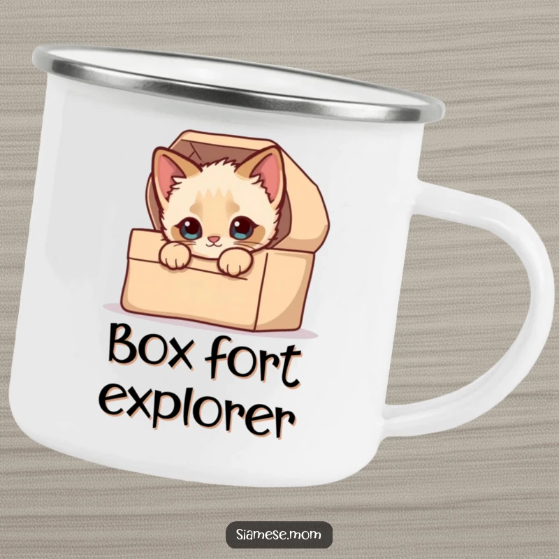 Funny Enamel Camping Mug: A kawaii Siamese kitten peeking curiously from a small, cozy box during an outdoor scene.
