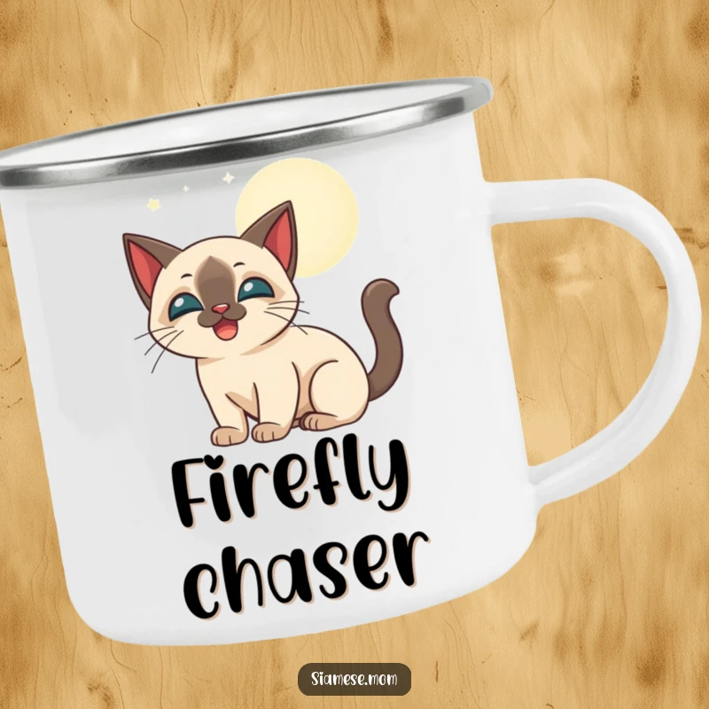 Funny stylized Siamese cat happily batting at glowing moonbeams, printed on a sturdy camping mug.