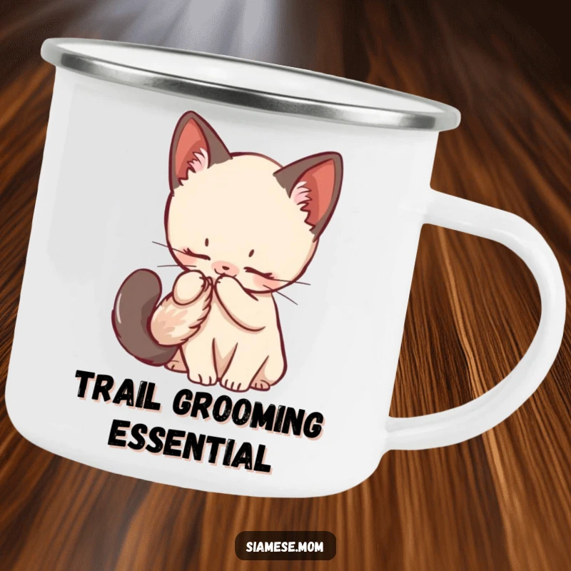 Funny Siamese Kitten Camping Mug featuring a kawaii cat grooming its fluffy tail, perfect for cozy and cute outdoor sips.
