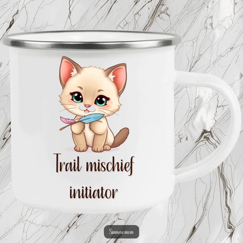 Funny Siamese Kitten Camping Mug with a kawaii cat's mischievous grin holding a feather, ideal for adventurous, playful sippers.