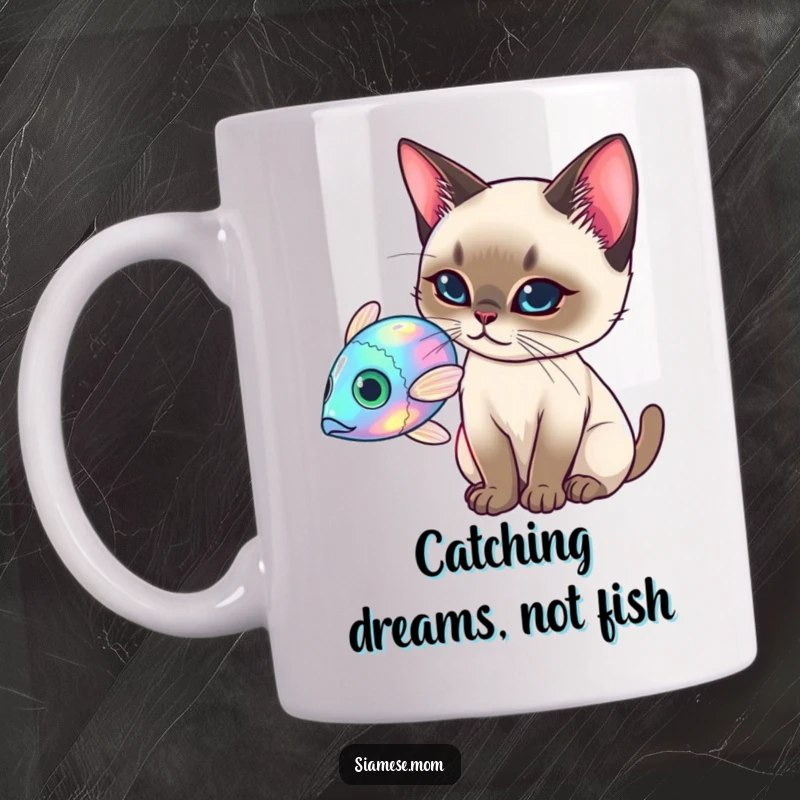 Funny Siamese Cat Mug, elegant cat batting at a holographic fish, playful and tech-themed funny gift.