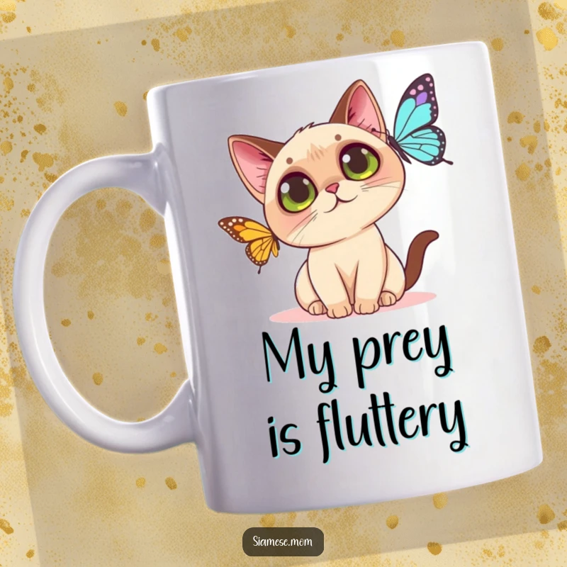 Funny Kawaii Siamese cat mug featuring a wide-eyed kitty playfully batting at a fluttering butterfly, showcasing pure, curious joy.