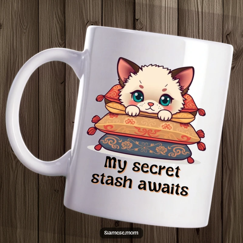 Funny Siamese cub peeking humorously from behind a pile of ornate cushions, showcasing its playful curiosity and cute face on a mug.