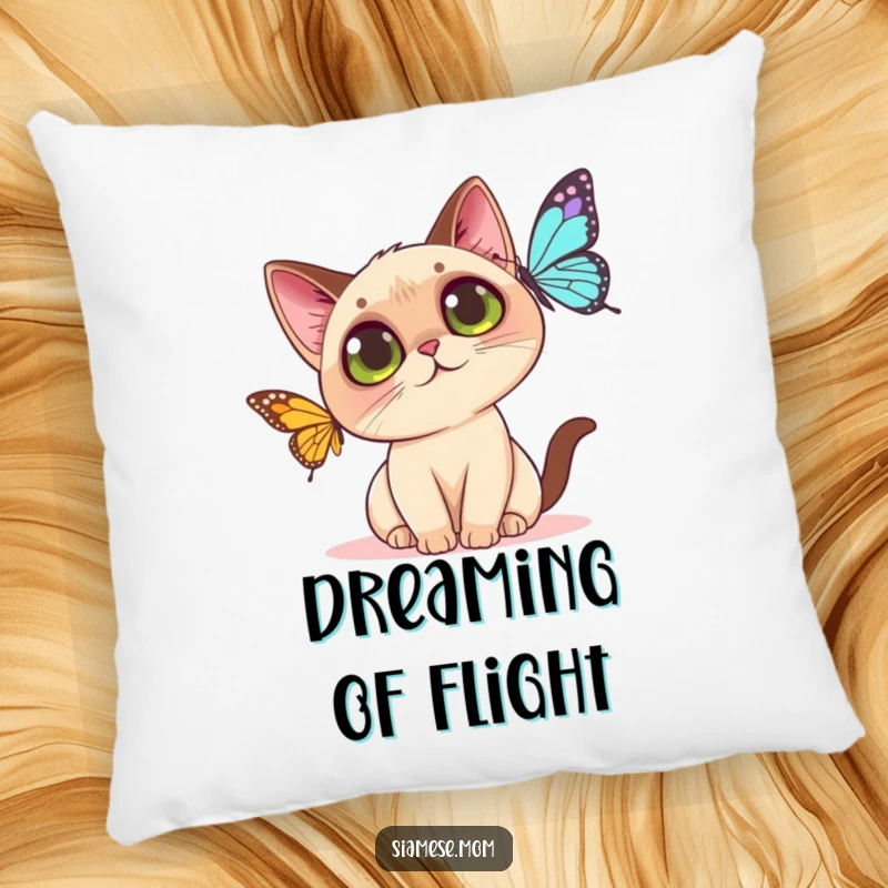 Funny Kawaii Siamese cat pillow showing a big-eyed cat intently focused on catching a butterfly, soft and huggable.