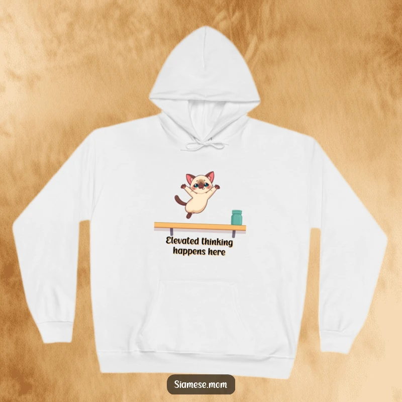 Funny Kawaii Siamese cat hoodie featuring a dynamic leap towards a shelf, capturing a moment of pure, humorous athleticism.
