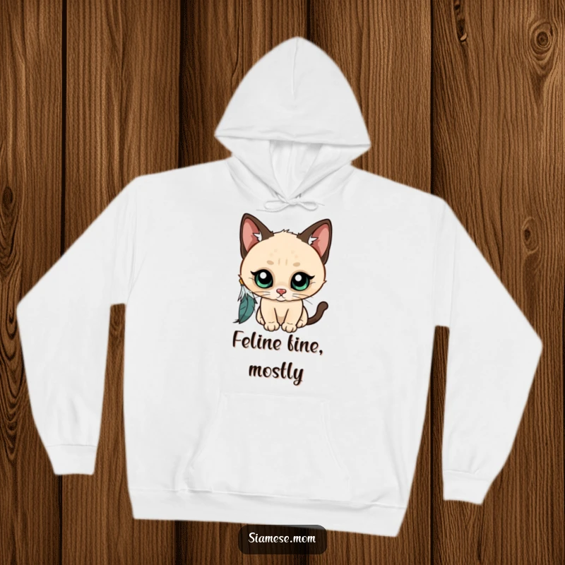Funny Kawaii Siamese cat hoodie, wide-eyed and curious, batting at a dangling feather, showcasing adorable and playful kitty antics.