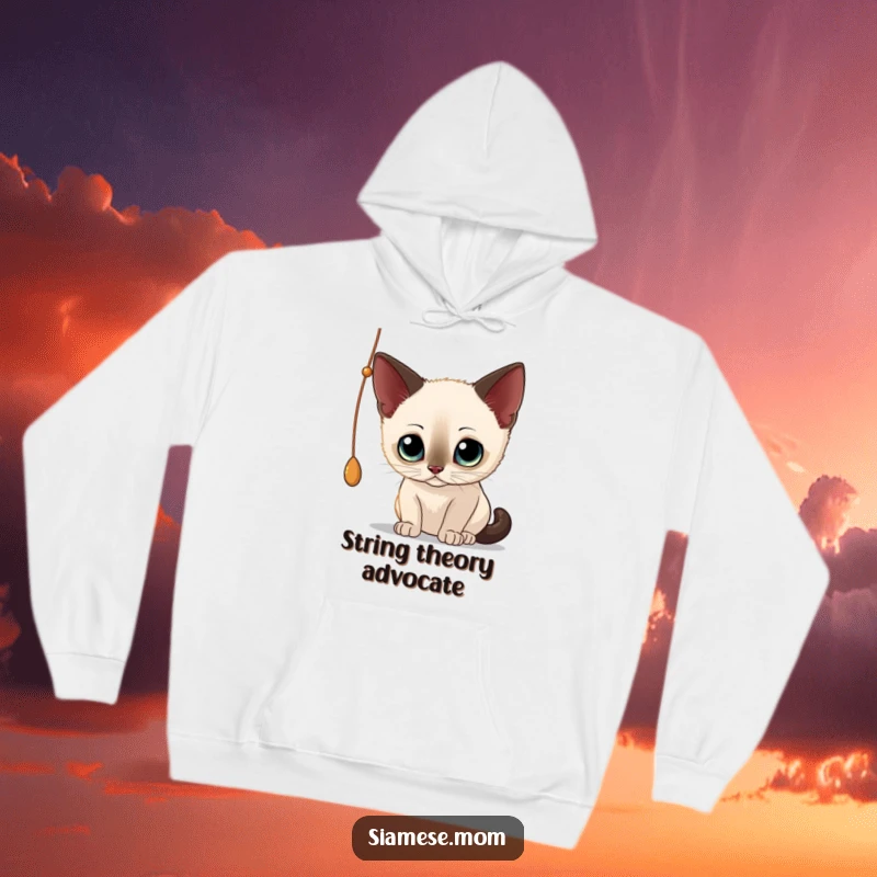 Funny Siamese Cat Hoodie: Cute cat engrossed in batting a dangling string, exuding playful curiosity and charm.