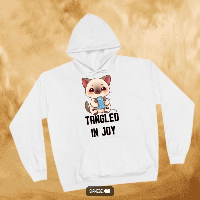 Funny hoodie showcasing a kawaii Siamese cat playing with a ball of yarn, offering cozy comfort and feline charm.