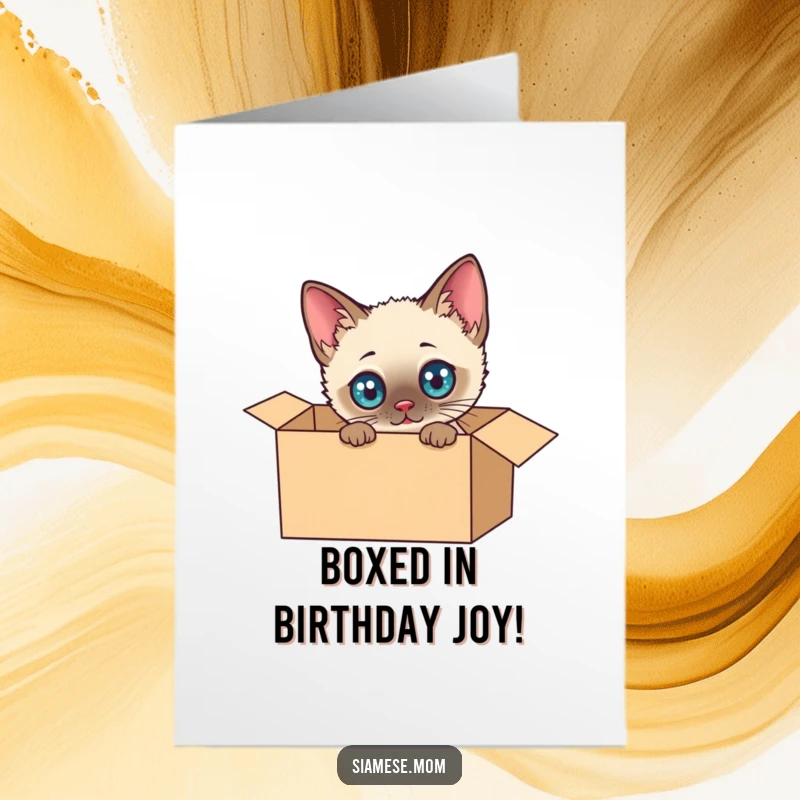 Funny Free Printable Birthday Card: Kawaii Siamese cat with wide eyes playfully exploring a cardboard box.