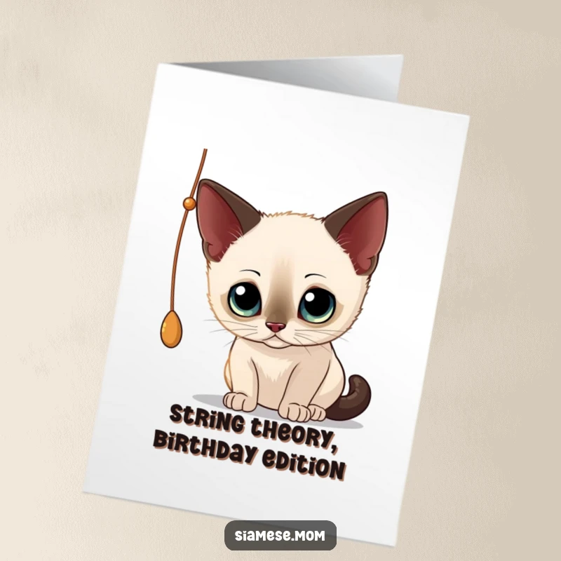 Funny Free Printable Birthday Card: A curious Siamese cat with big eyes playfully batting at a dangling string.
