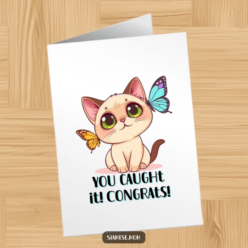 Funny free printable congratulations card: A kawaii Siamese cat with curious eyes playfully reaching for a butterfly, celebrating success.