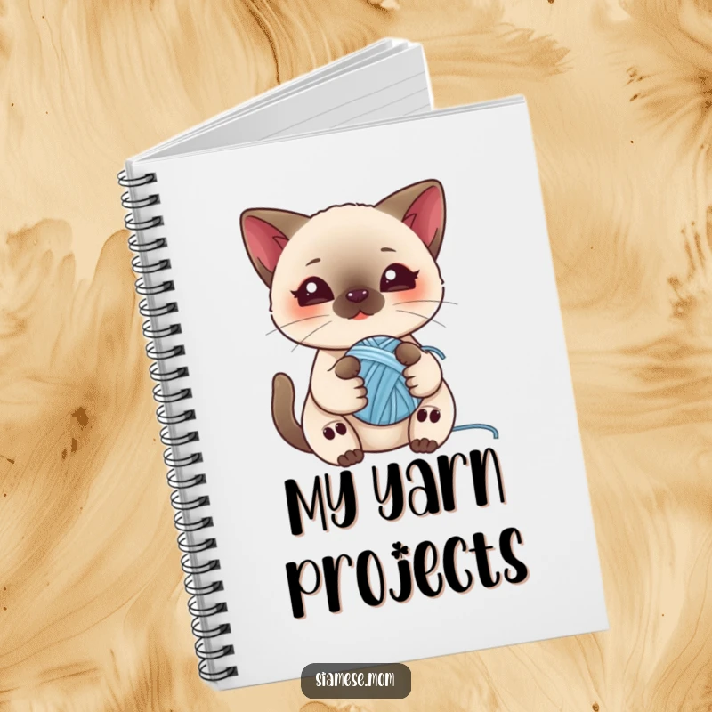 Funny notebook with a kawaii Siamese cat playing with a ball of yarn, perfect for jotting down notes and cat-themed ideas.