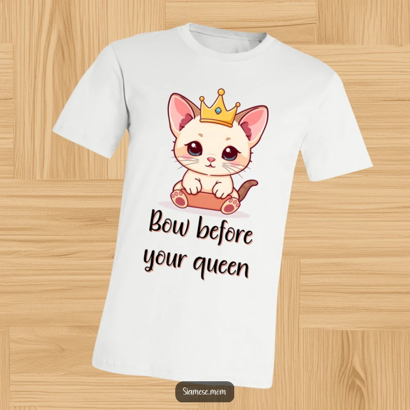 Funny Siamese Kitten T-Shirt featuring a kawaii cat playfully balancing a tiny crown, exuding regal charm.