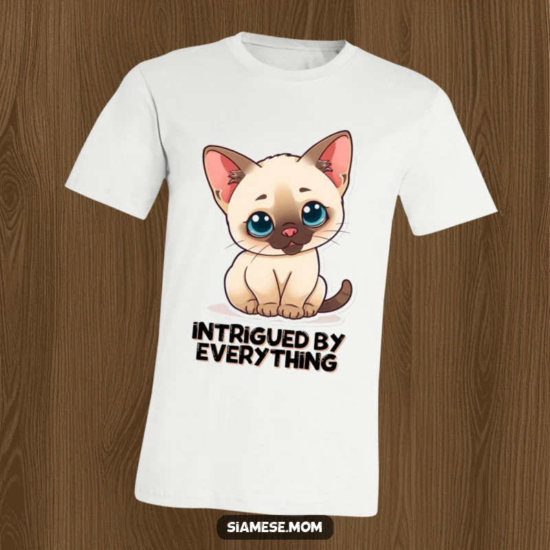 Funny T-shirt featuring a curious kawaii Siamese cat arching its back with perked ears, expressing playful wonder.
