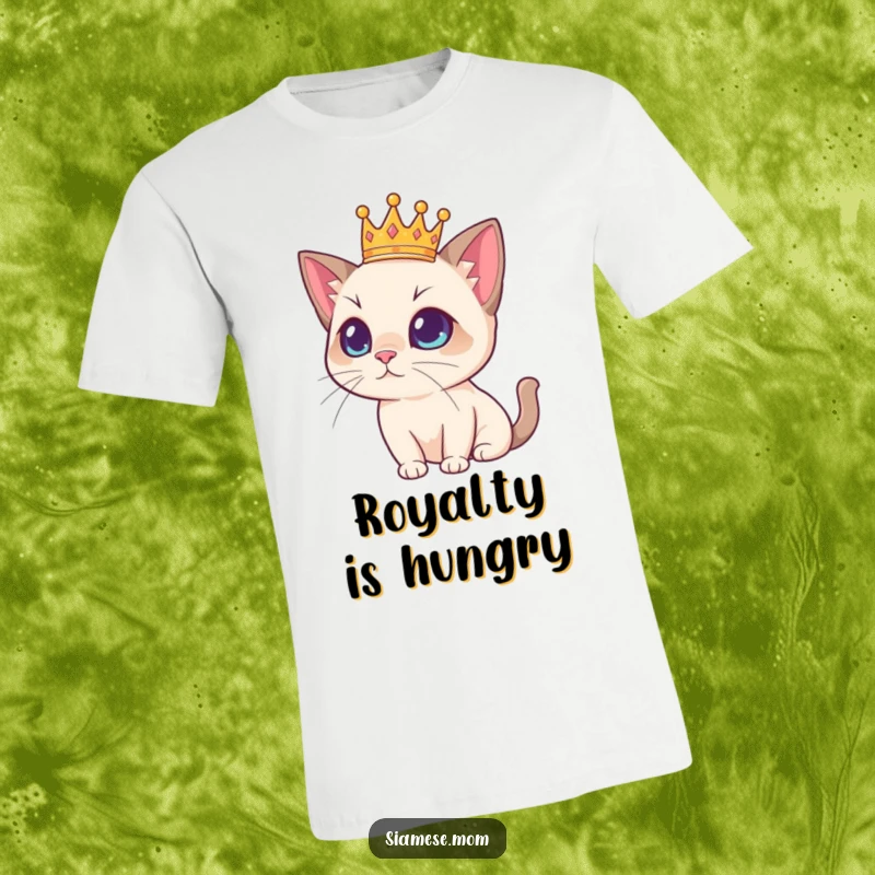 Funny Siamese cat wearing a tiny crown, exuding regal charm on a comfortable t-shirt, a humorous statement for cat lovers.
