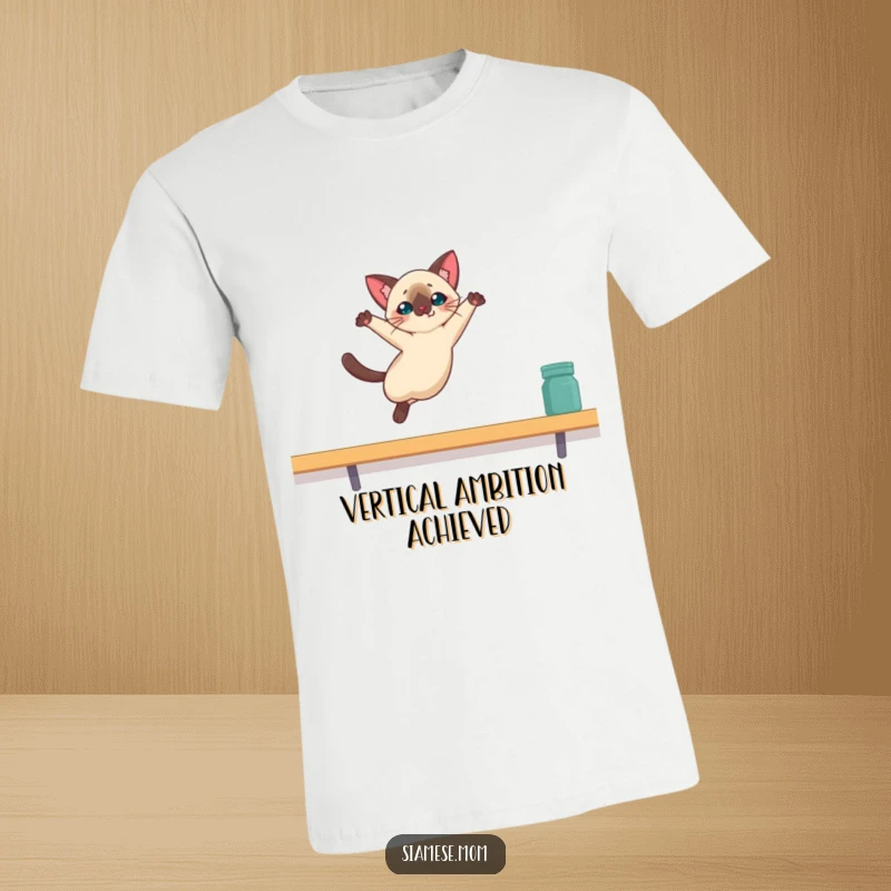 Funny Kawaii Siamese cat t-shirt showing a dramatic leap towards a high shelf, embodying feline ambition and wit.