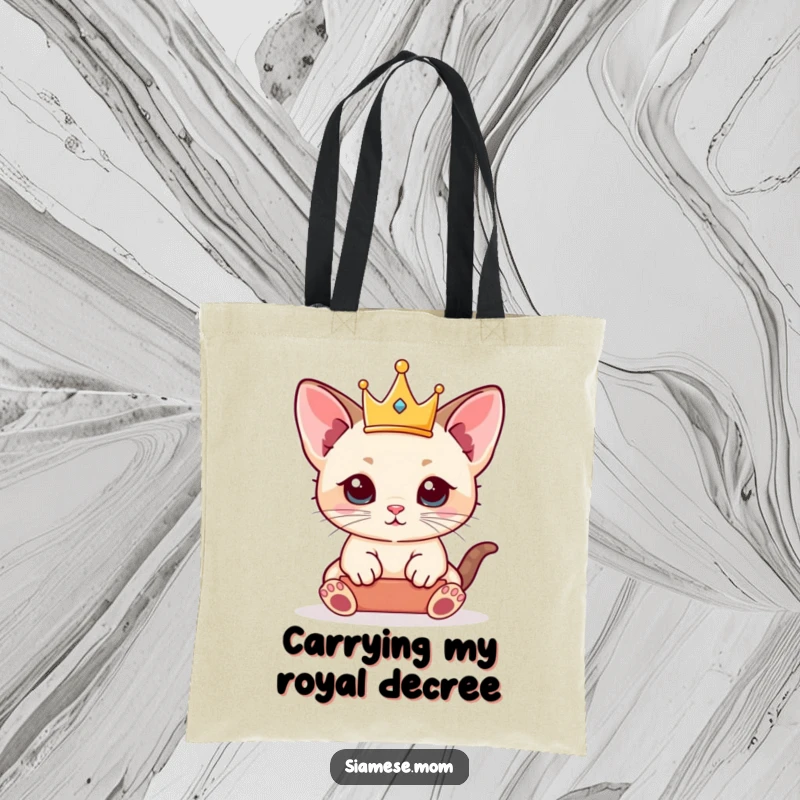 Funny Siamese Kitten Tote Bag showcasing a kawaii cat balancing a tiny crown, perfect for carrying essentials with royal flair.