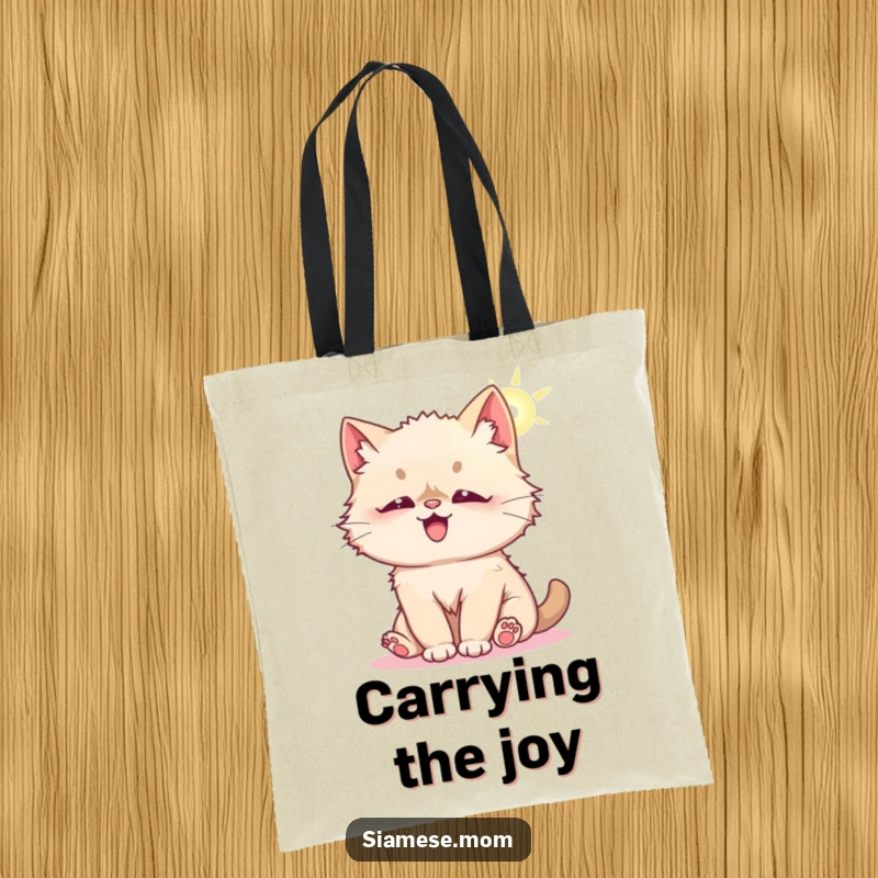 Funny tote bag featuring a fluffy Kawaii Siamese cat playfully batting at a sunbeam, representing joy and lightheartedness.