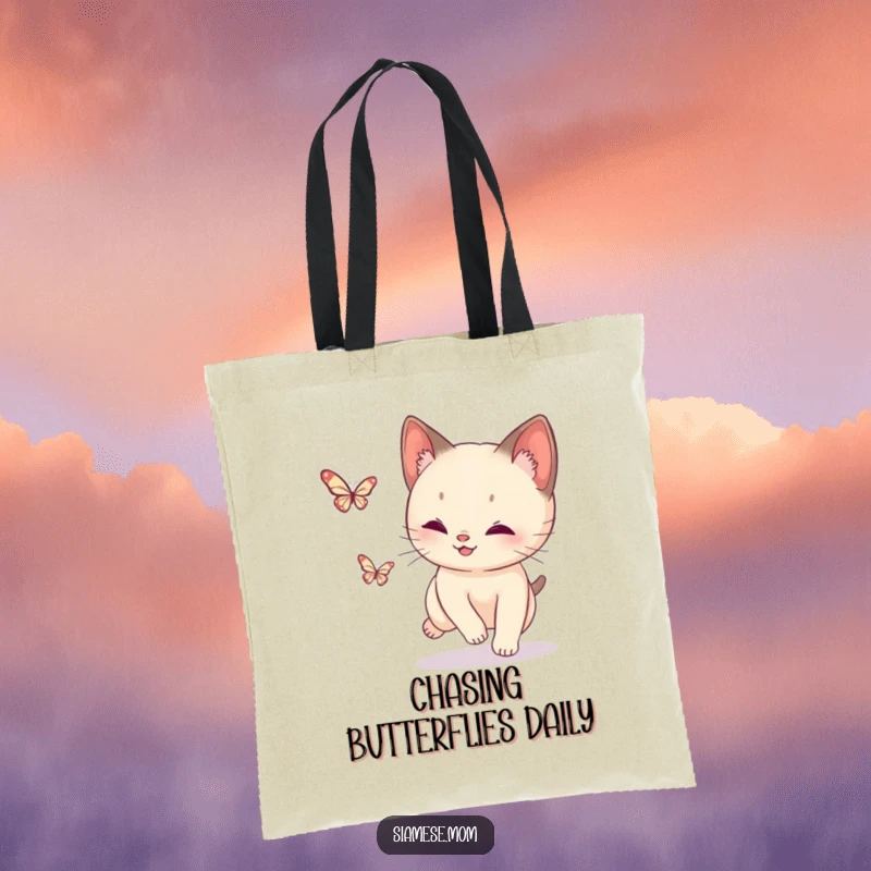 Funny Siamese Cat Butterfly Tote Bag: Durable bag showcasing a playful cat chasing a sparkling butterfly, great for shopping.