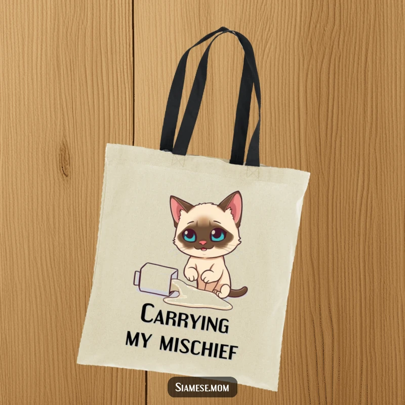 Funny Siamese cat tote bag, looking smugly at a spilled milk carton, perfect for carrying essentials with humor, a great funny gift.