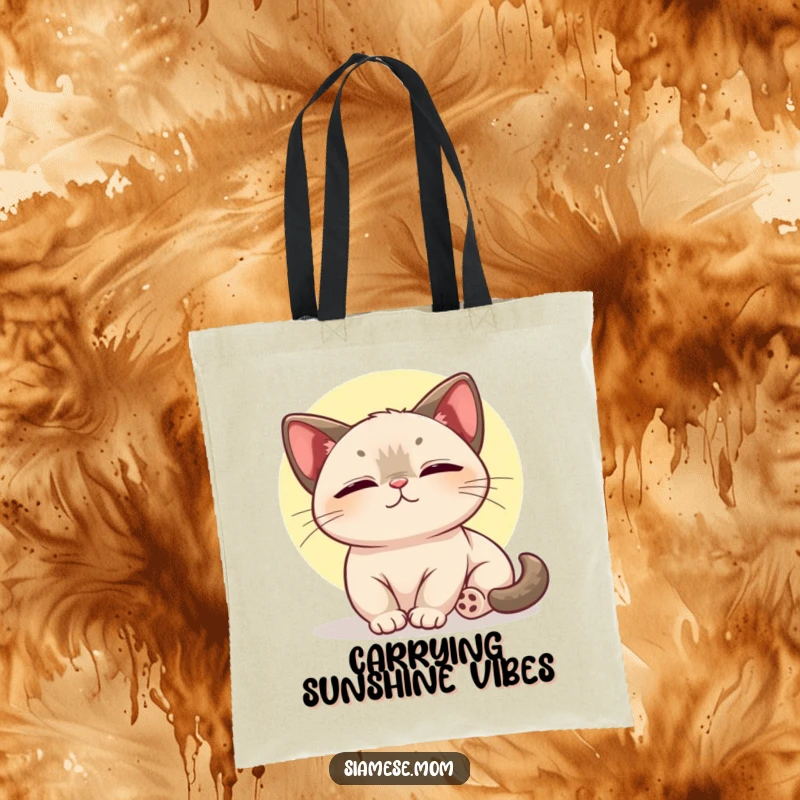 Funny tote bag design of a kawaii Siamese cat enjoying the warmth and pure joy of a sunbeam.