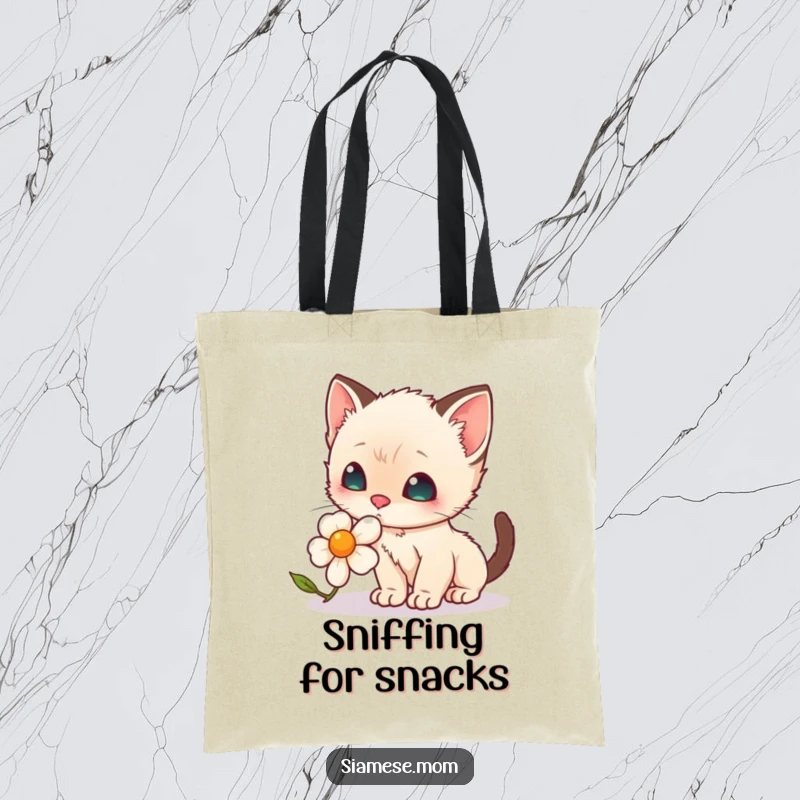 Funny Eco Tote Bag: A kawaii Siamese kitten with a curious expression sniffing a delicate pink rose.